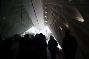 A group of people standing in front of a building.