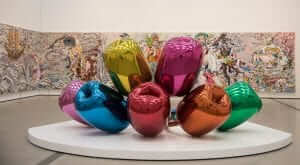 A group of colorful balloons in a museum.