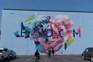 A mural of flowers on a building in los angeles.