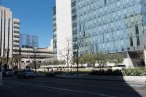 A large building with cars parked in front of it.