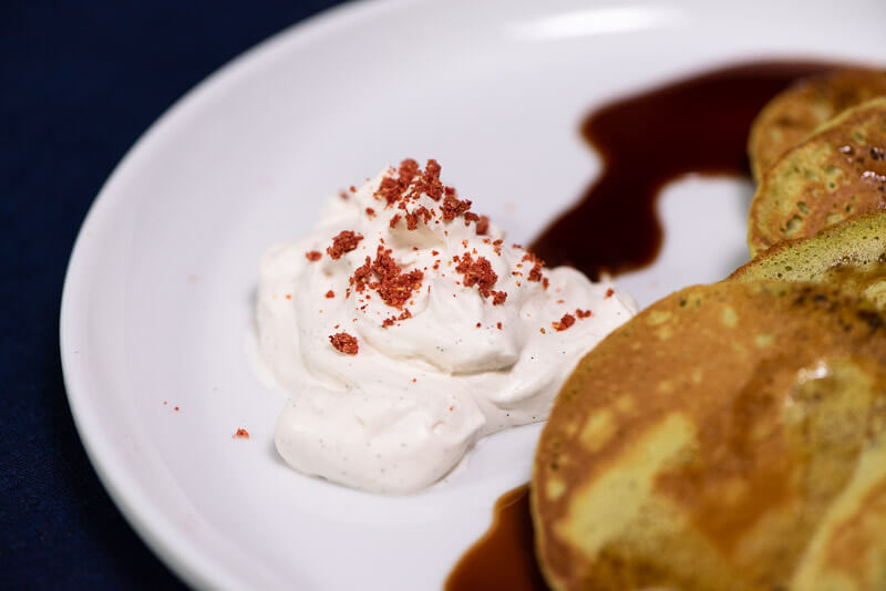 matcha pancakes with kuromitsu and vanilla bean cream closeup