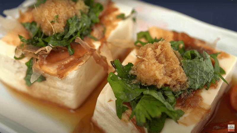 Japanese cold tofu with a little bit of shoyu (soy sauce) and freshly grated ginger