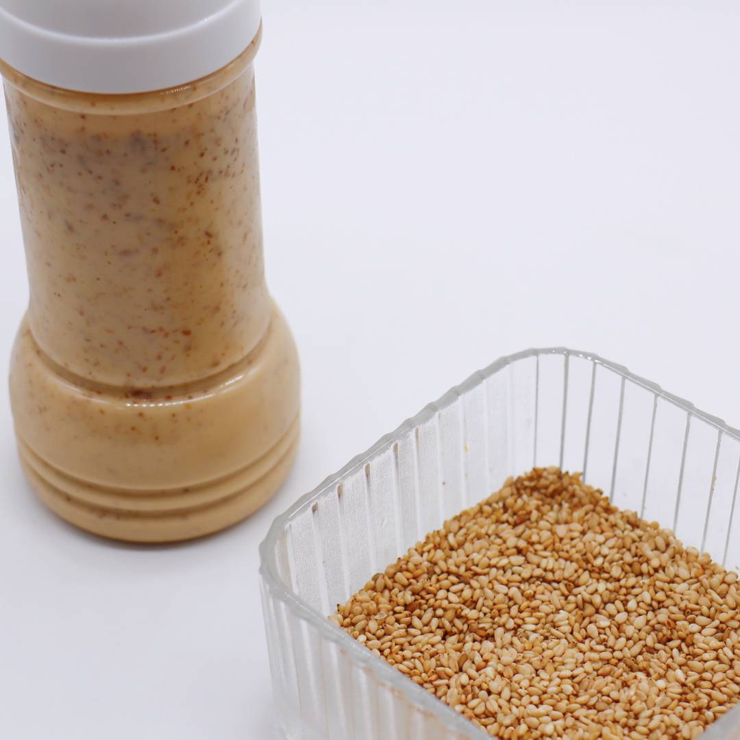 bottle of japanese sesame dressing with sesame seeds