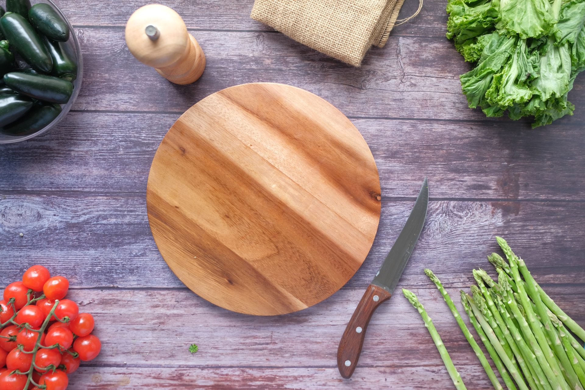 An image showcasing a pristine hinoki cutting board alongside a well-worn bamboo cutting board