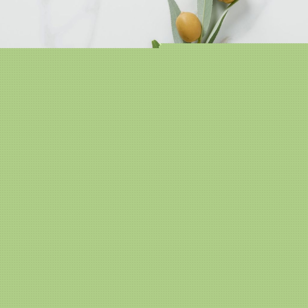 Refined olive oil and extra olive oil sits on the table.