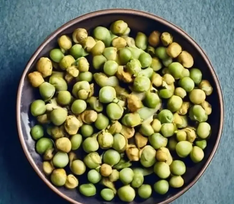 Wasabi peas in a bowl on a table.